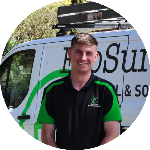 Matt from EcoSurge Electrical standing in front of his work van in the Barossa Valley.n